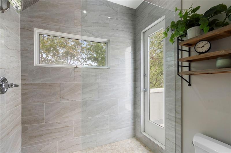 2188 Millennium Way Brookhaven, GA 30319 - Photo 44 of 52 a bathroom with a window and a shower