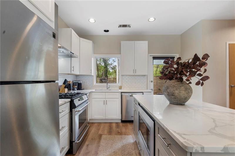 2188 Millennium Way Brookhaven, GA 30319 - Photo 7 of 52 a kitchen with a sink appliances and cabinets