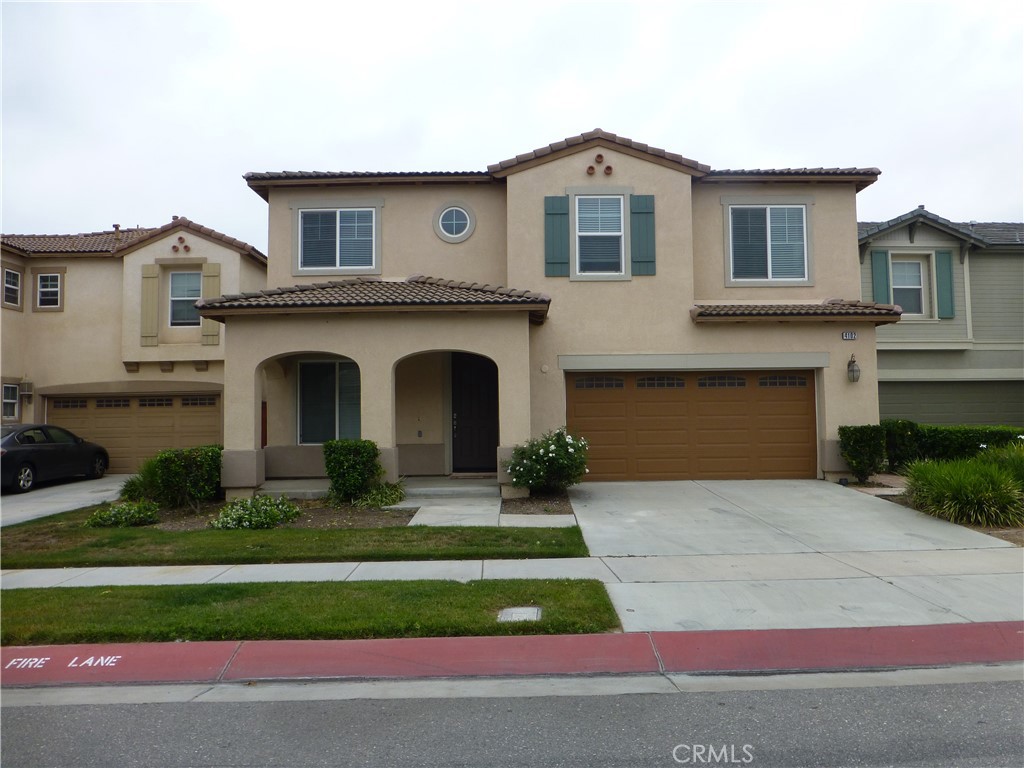 4102 Garvey Way Riverside, CA 92501 - Photo 1 of 1 a front view of a house with a yard