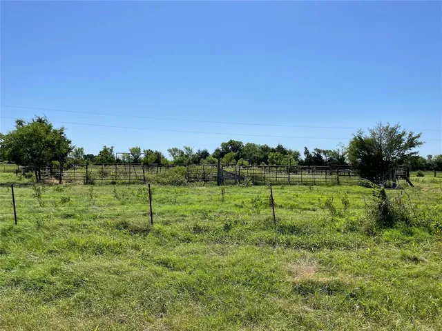 a view of outdoor space with deck and yard