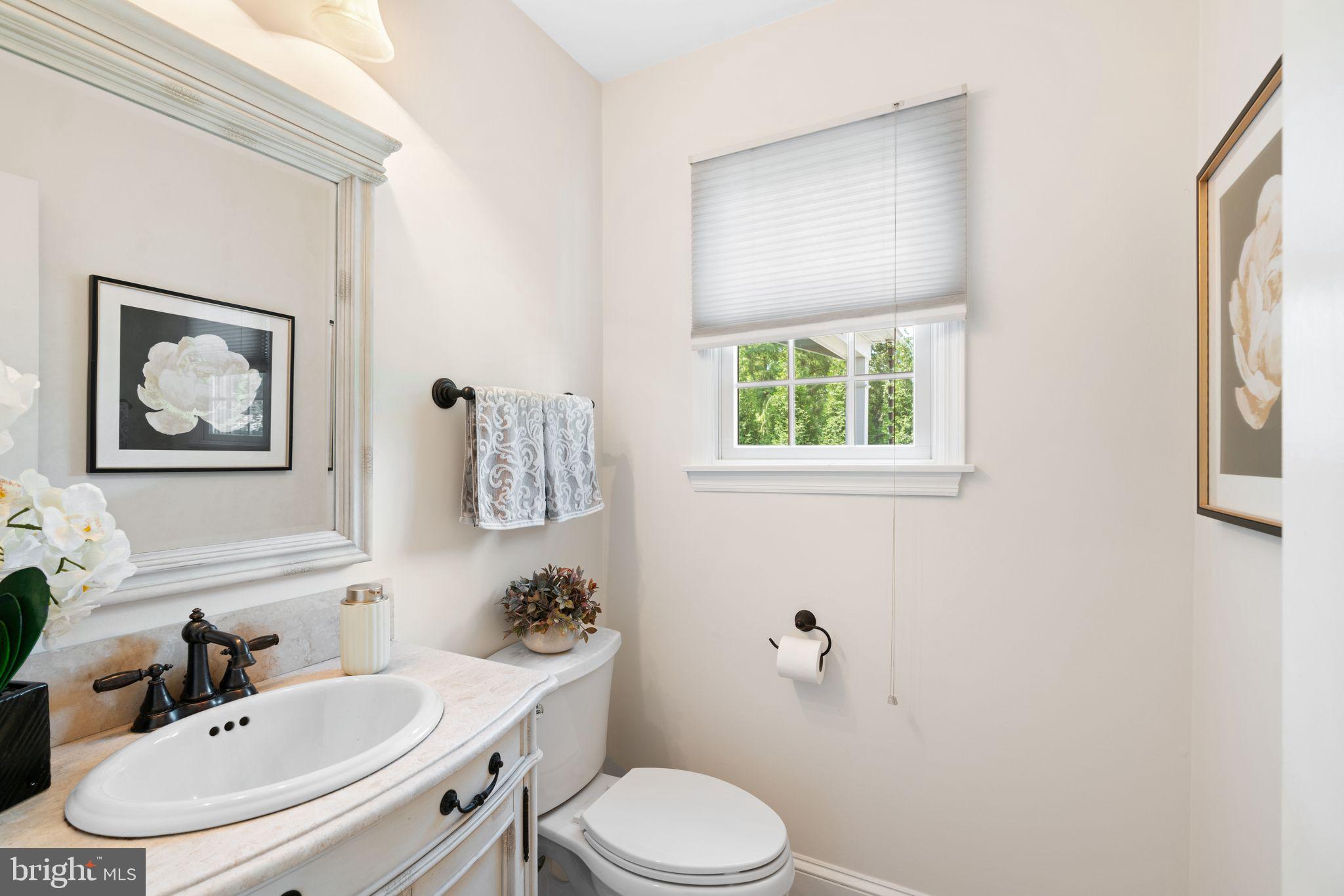 320 Warwick Road Haddonfield, NJ 08033 - Photo 16 of 41 a bathroom with a toilet sink and mirror