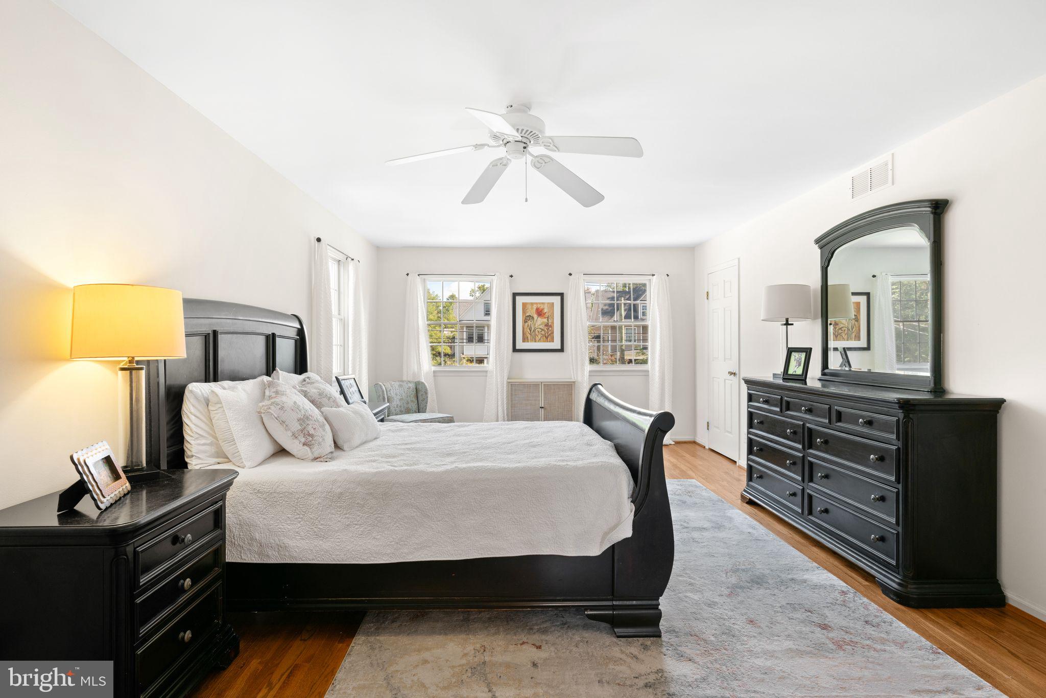 320 Warwick Road Haddonfield, NJ 08033 - Photo 20 of 41 a bedroom with a bed and wooden floor