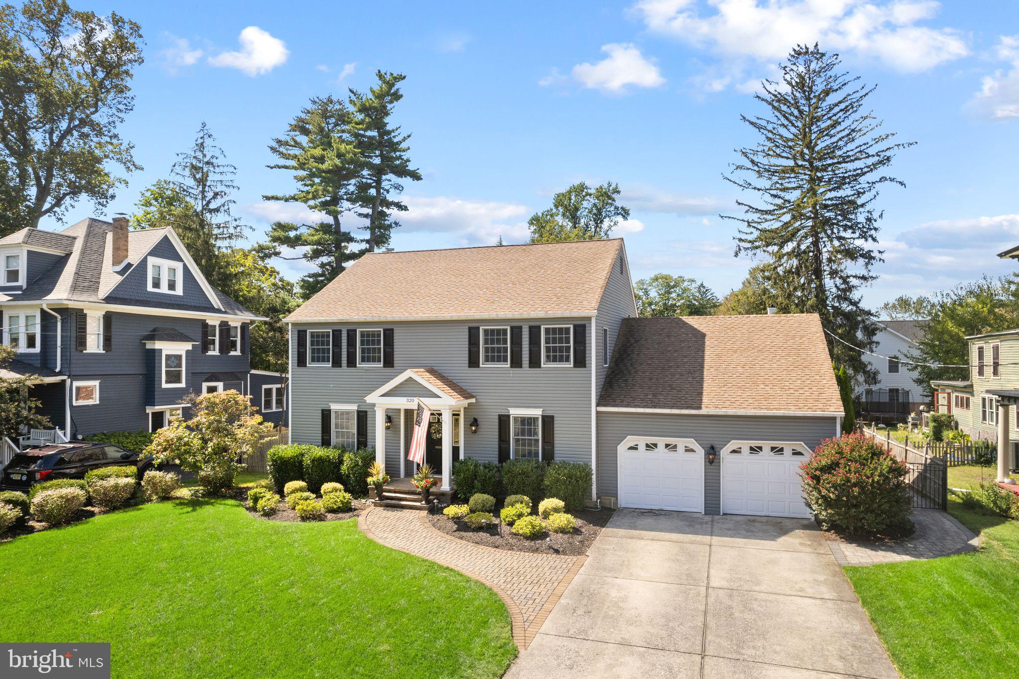 320 Warwick Road Haddonfield, NJ 08033 - Photo 2 of 41 a front view of a house with garden