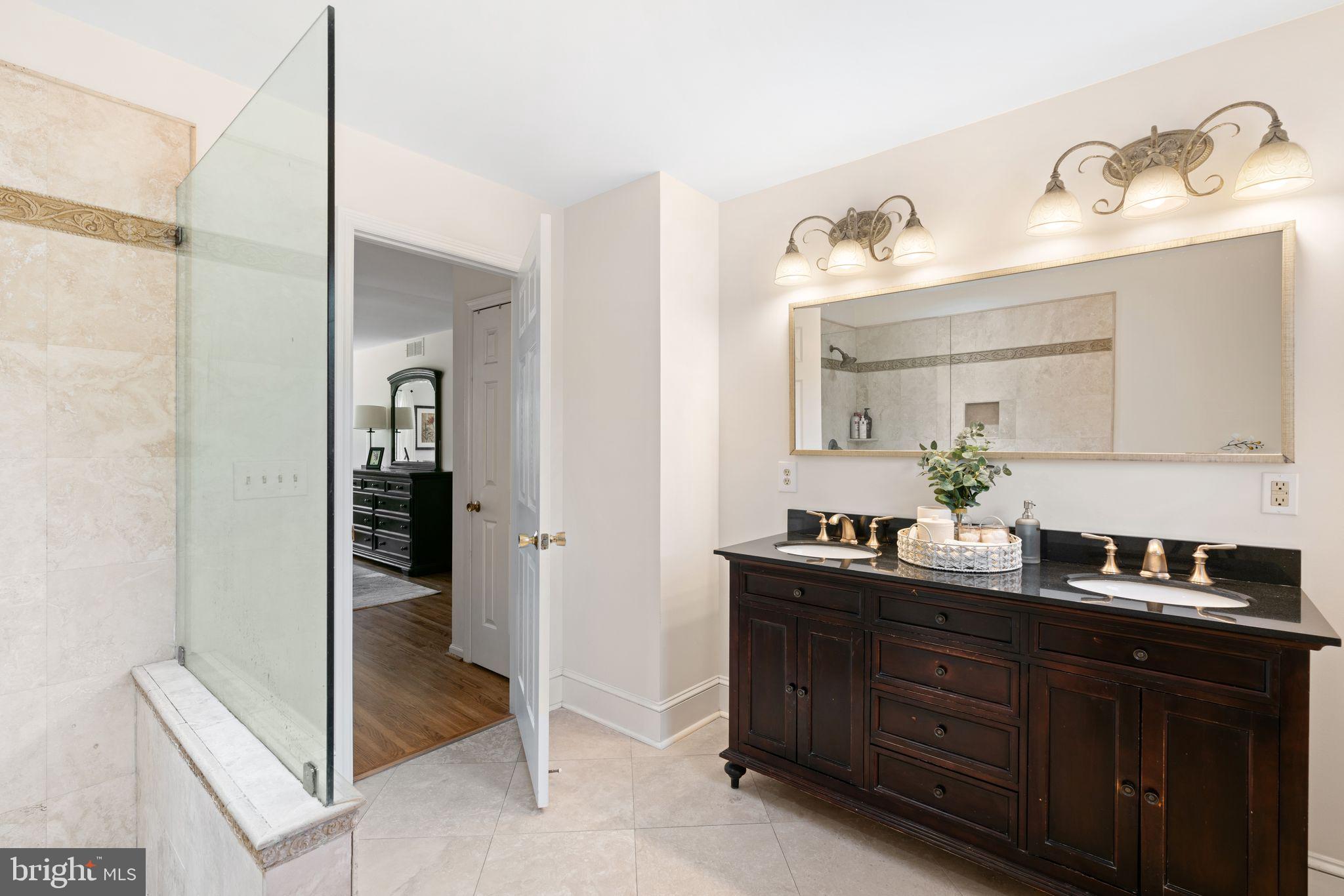 320 Warwick Road Haddonfield, NJ 08033 - Photo 23 of 41 a bathroom with a double vanity sink and mirror