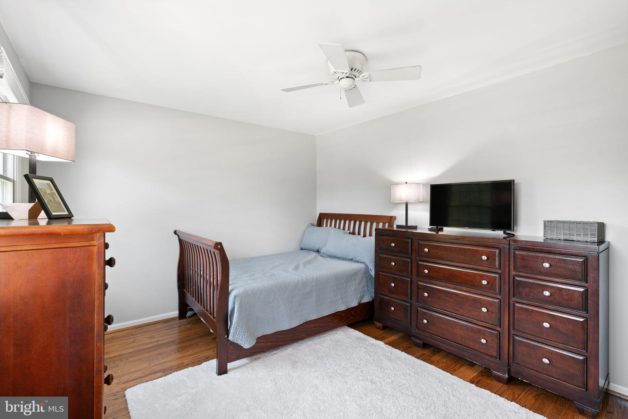 320 Warwick Road Haddonfield, NJ 08033 - Photo 24 of 41 a bedroom with a bed and a flat screen tv