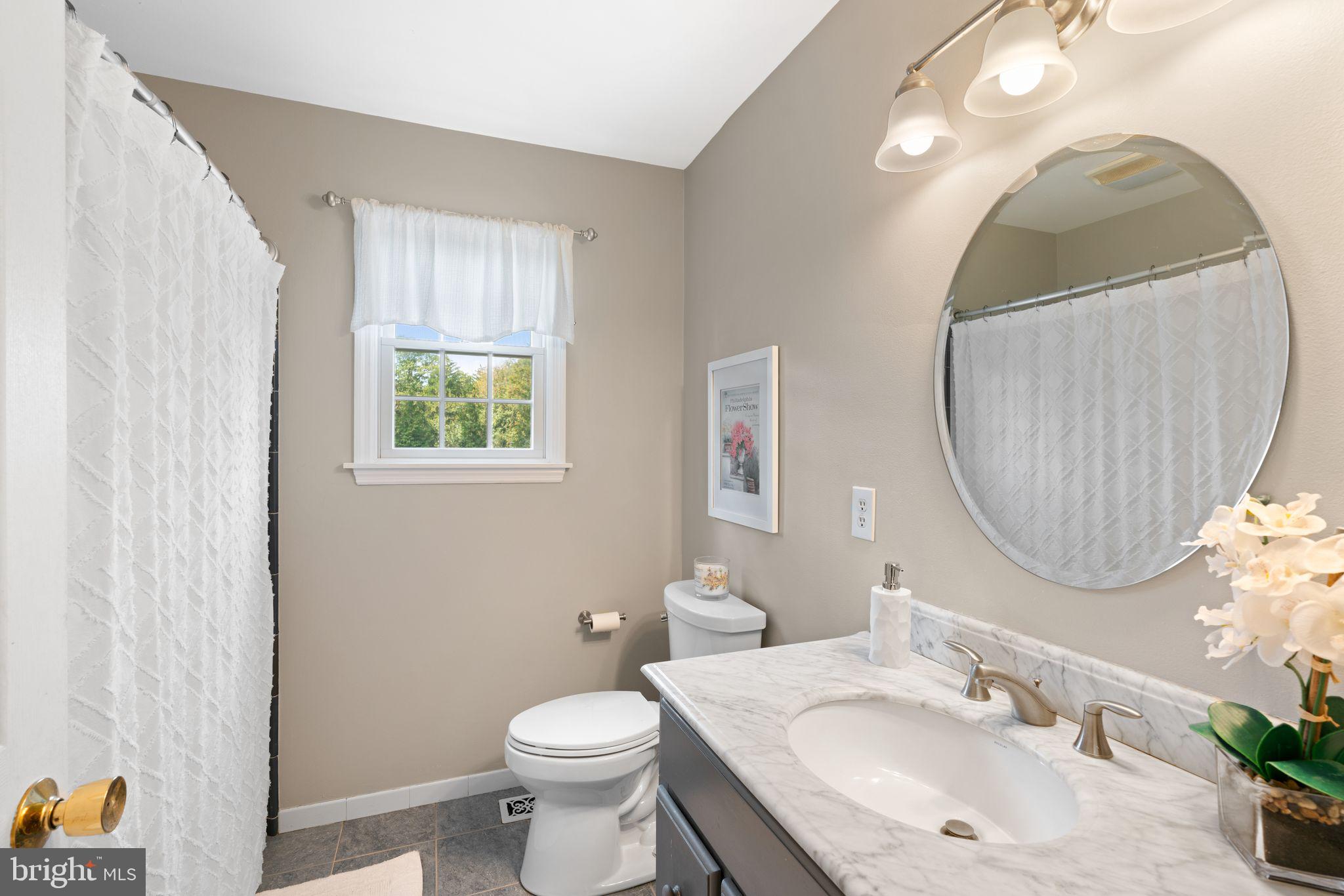 320 Warwick Road Haddonfield, NJ 08033 - Photo 29 of 41 a bathroom with a sink and a mirror