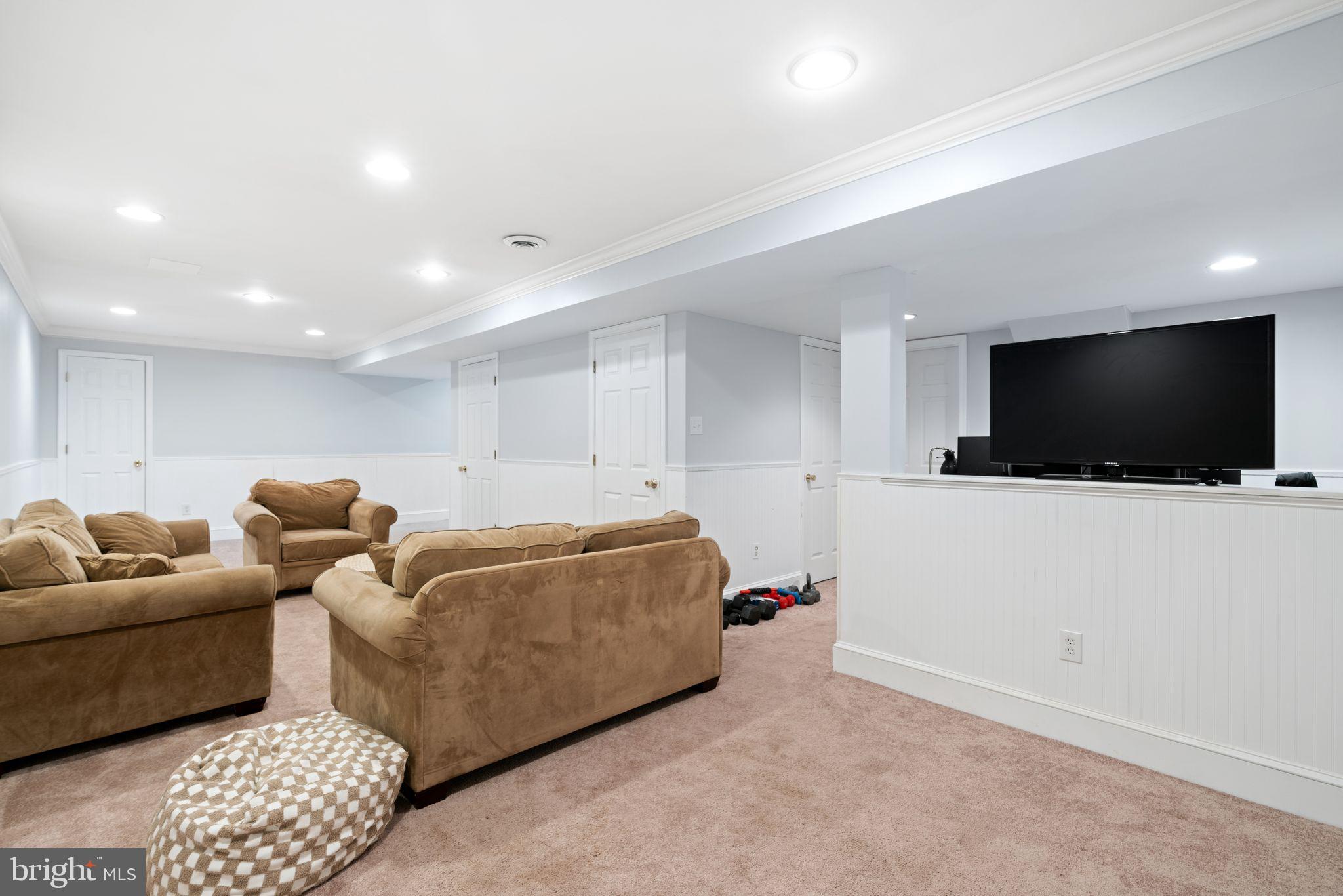320 Warwick Road Haddonfield, NJ 08033 - Photo 32 of 41 a living room with furniture and a flat screen tv