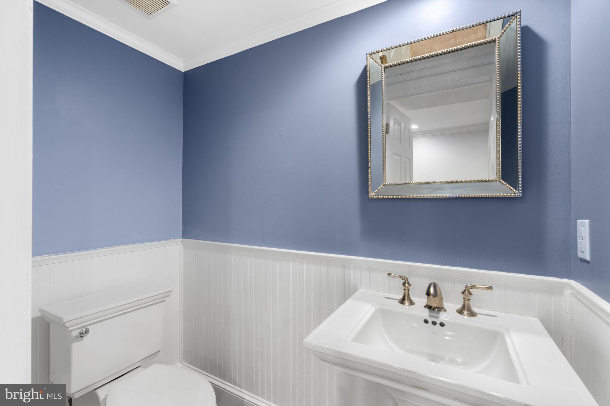 320 Warwick Road Haddonfield, NJ 08033 - Photo 35 of 41 a bathroom with a sink a toilet and mirror