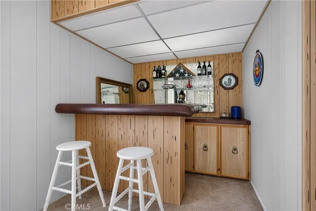 a bedroom with a bed and a table