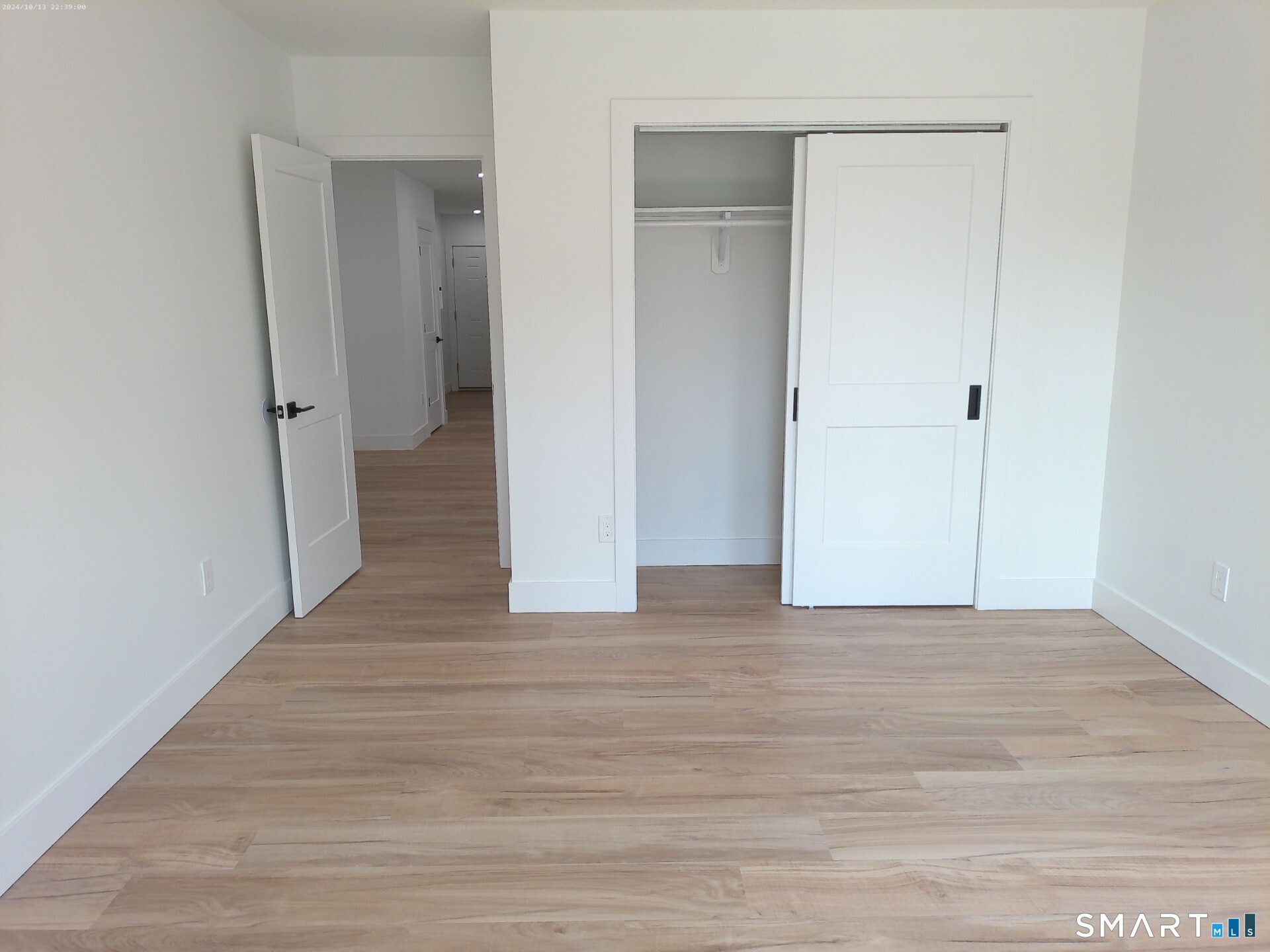 365 Broad Street, Unit 2E New Britain, CT 06053 - Photo 7 of 12 a view of a hallway with wooden floor