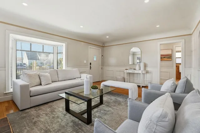 a living room with furniture and a table