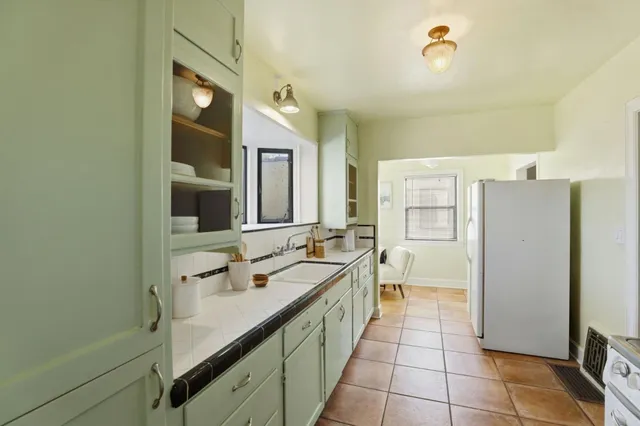 a bathroom with a sink a mirror and a bathtub
