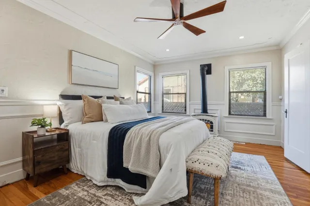 a bed room with a bed and a window