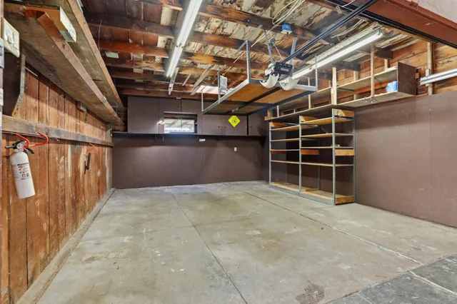 a view of an empty room with wooden walls