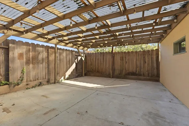 a view of an empty room with wooden walls