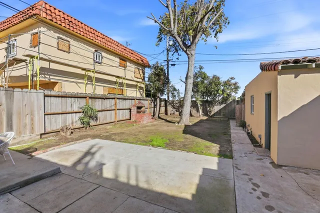 a view of a backyard with a patio