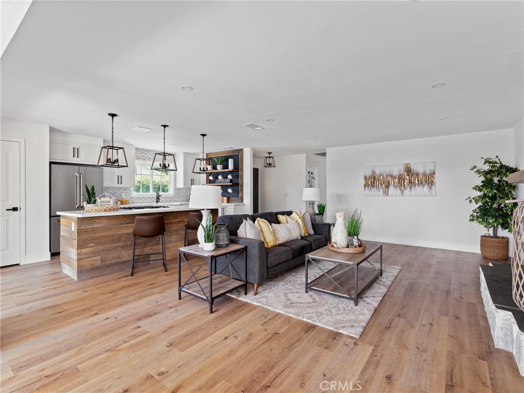 8419 18th Street Rancho Cucamonga, CA 91701 - Photo 14 of 28 a living room with furniture and a wooden floor