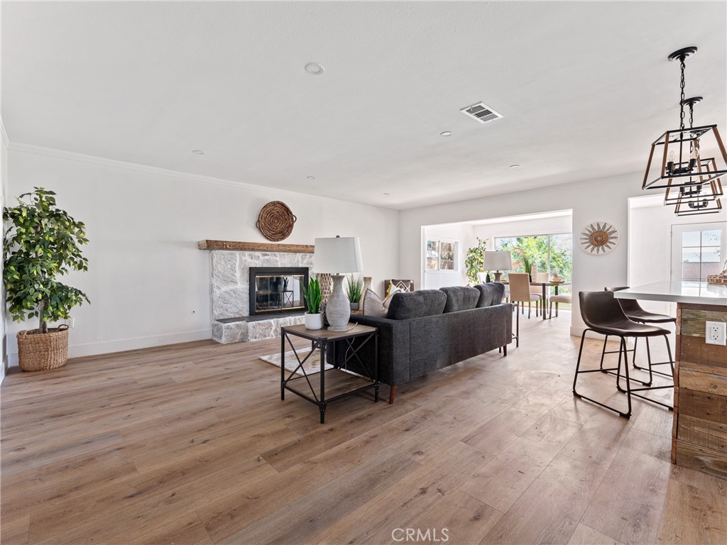 8419 18th Street Rancho Cucamonga, CA 91701 - Photo 15 of 28 a living room with furniture and a wooden floor
