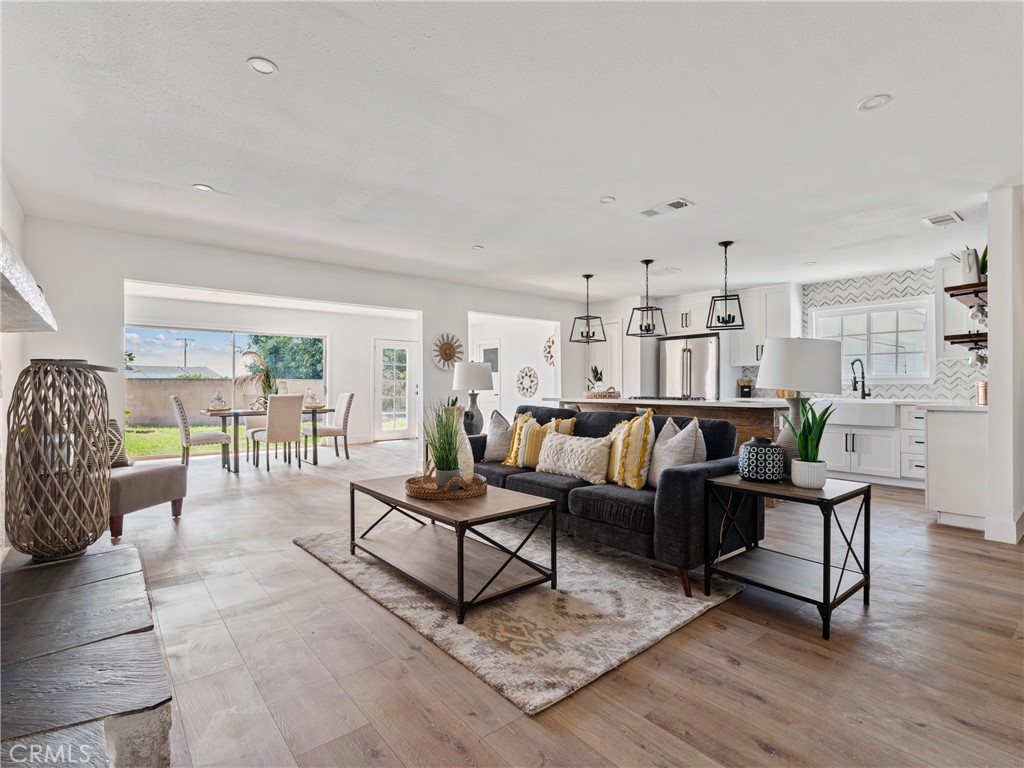 8419 18th Street Rancho Cucamonga, CA 91701 - Photo 17 of 28 a living room with furniture and a table