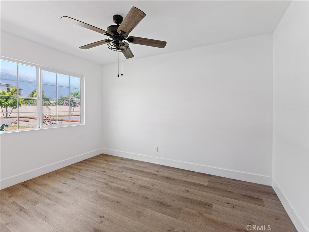 8419 18th Street Rancho Cucamonga, CA 91701 - Photo 22 of 28 wooden floor in an empty room with a window