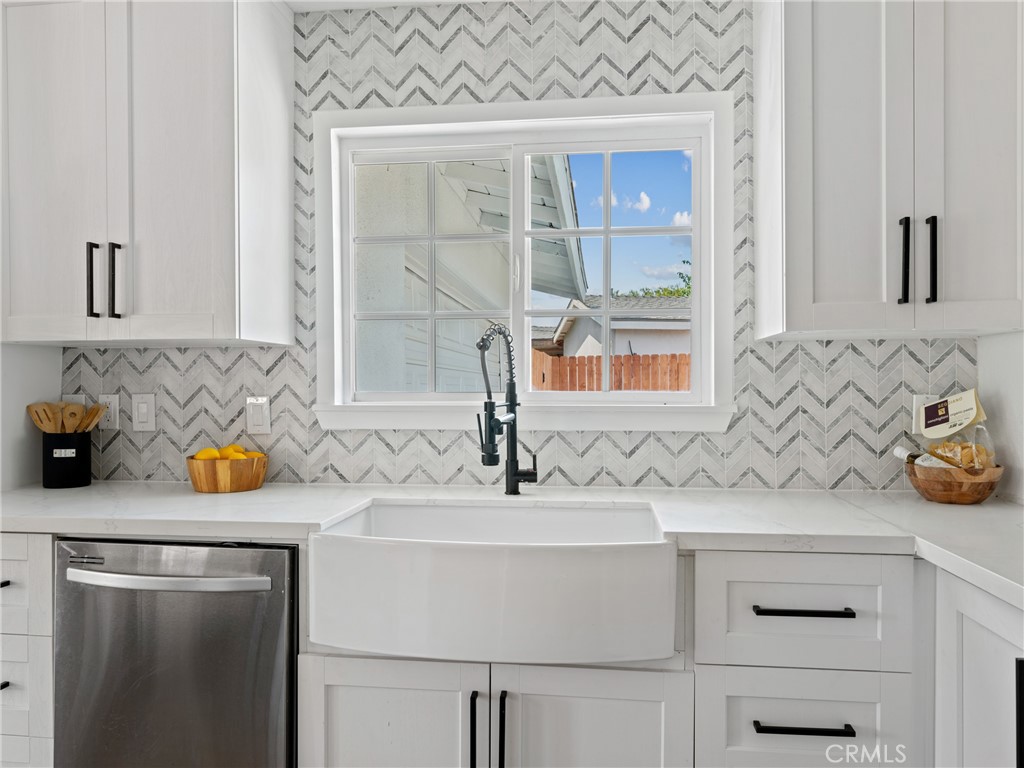 8419 18th Street Rancho Cucamonga, CA 91701 - Photo 7 of 28 a bathroom with a sink and a mirror
