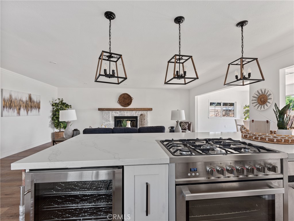 8419 18th Street Rancho Cucamonga, CA 91701 - Photo 8 of 28 a stove top oven sitting inside of a kitchen