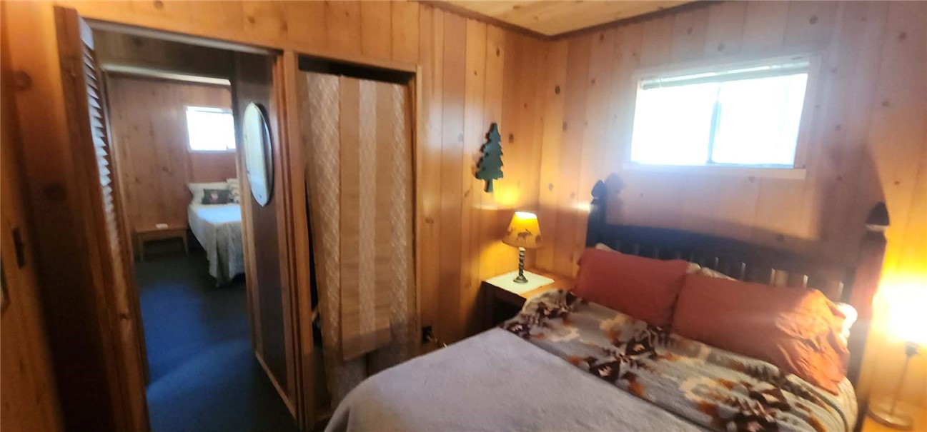 7515 Abner Lane Forest Ranch, CA 95942 - Photo 15 of 65 a bedroom with a bed and a mirror