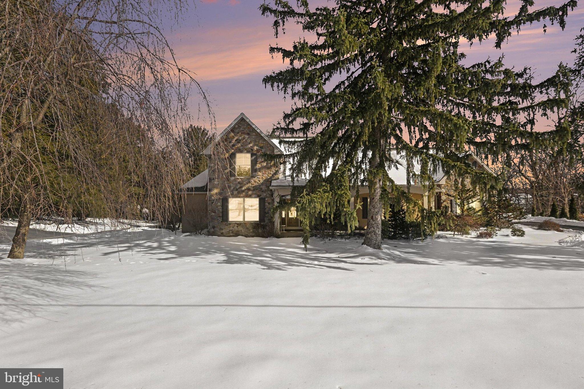 Charming home nestled in a winter wonderland.