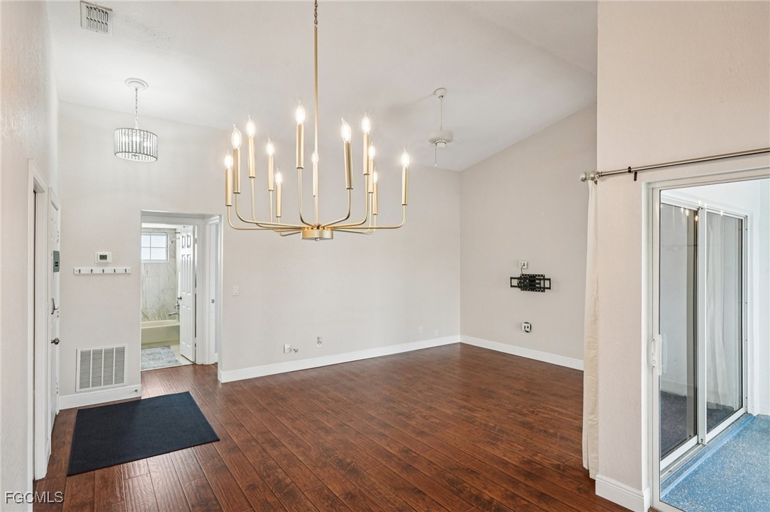 14983 Rivers Edge Court, Unit 230 Fort Myers, FL 33908 - Photo 13 of 47 a view of a big room with wooden floor and windows