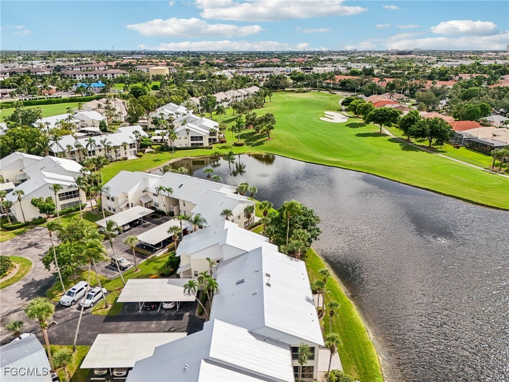 14983 Rivers Edge Court, Unit 230 Fort Myers, FL 33908 - Photo 30 of 47 an aerial view of a city with lots of residential buildings and mountain view in back