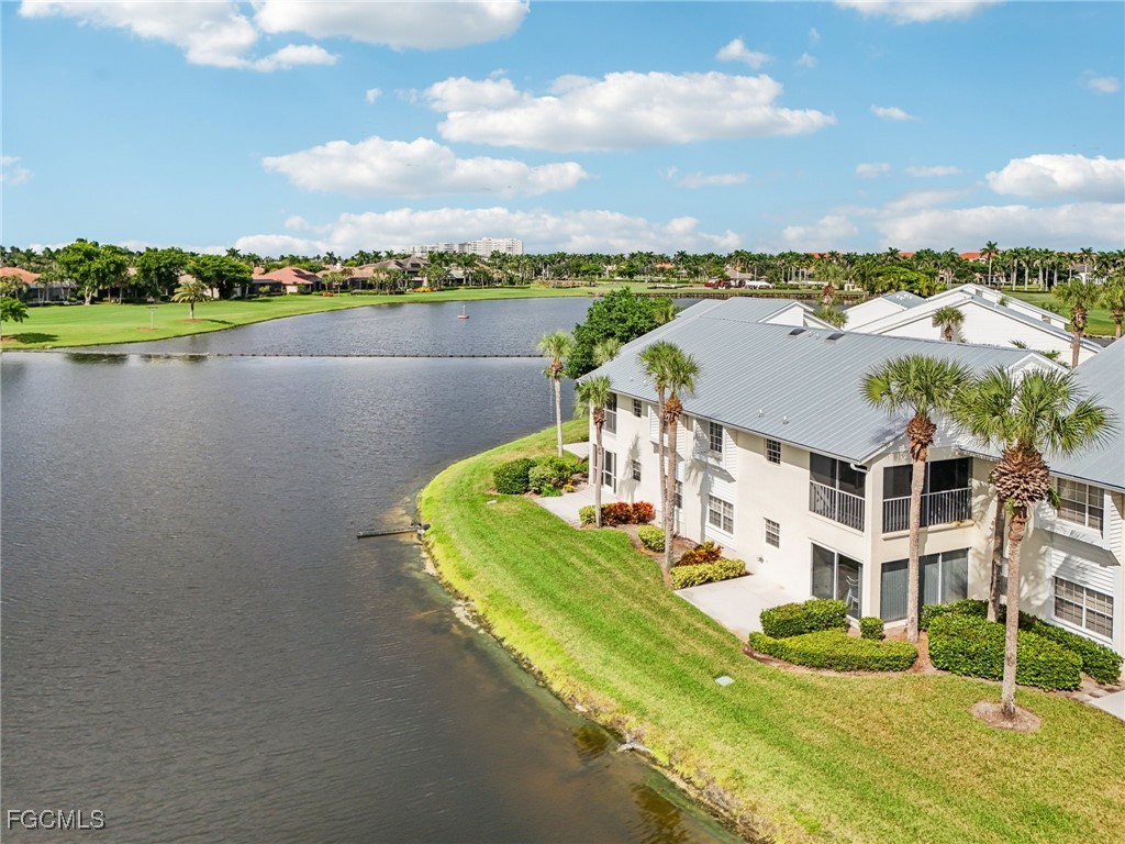 14983 Rivers Edge Court, Unit 230 Fort Myers, FL 33908 - Photo 34 of 47 a view of a lake with building in front of it