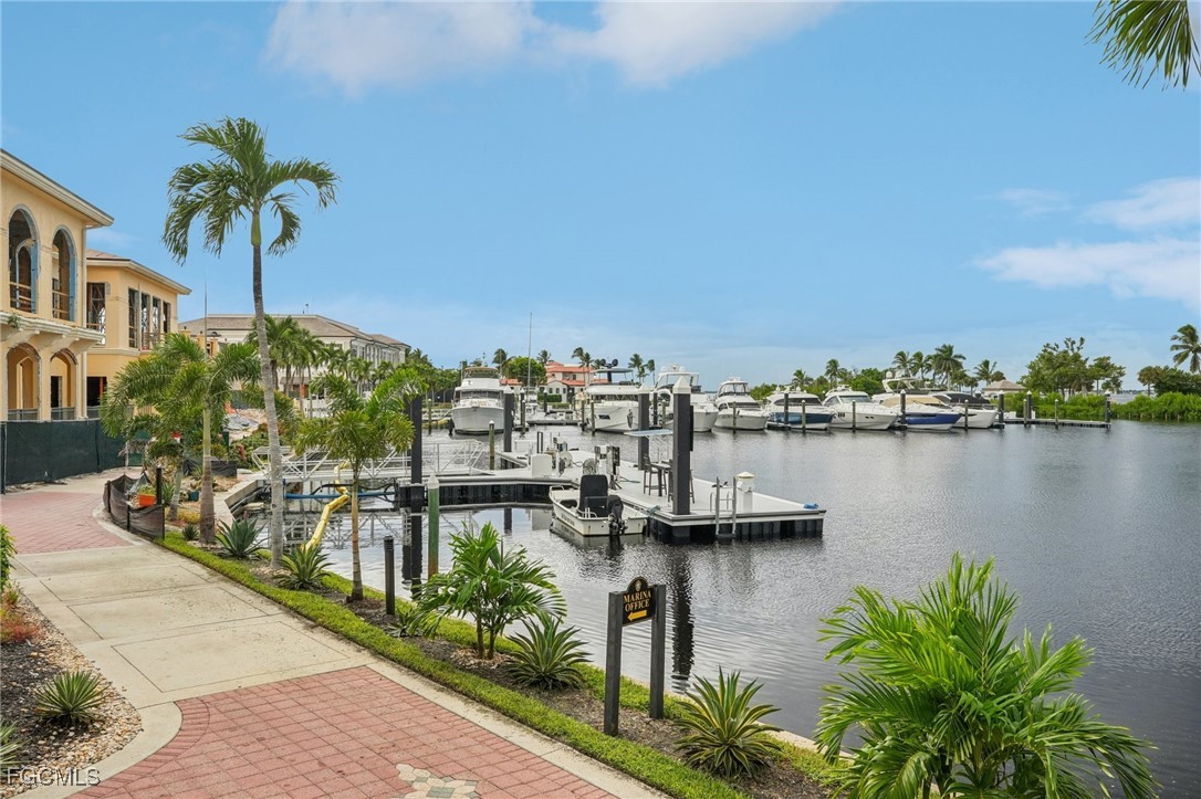 14983 Rivers Edge Court, Unit 230 Fort Myers, FL 33908 - Photo 46 of 47 a view of a lake with a building in front of it