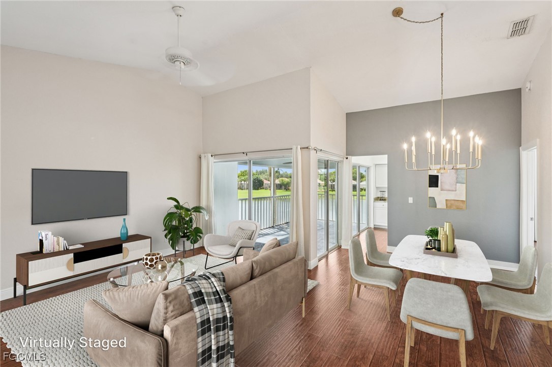 14983 Rivers Edge Court, Unit 230 Fort Myers, FL 33908 - Photo 7 of 47 a living room with furniture and a flat screen tv