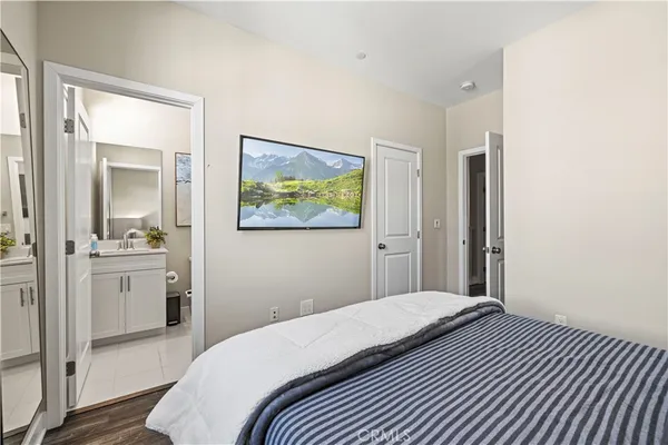 a bedroom with a bed and a view of bathroom