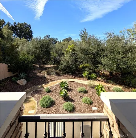 a view of backyard with swimming pool and outdoor seating