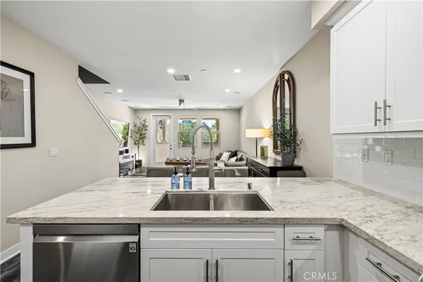 a kitchen with a sink and cabinets
