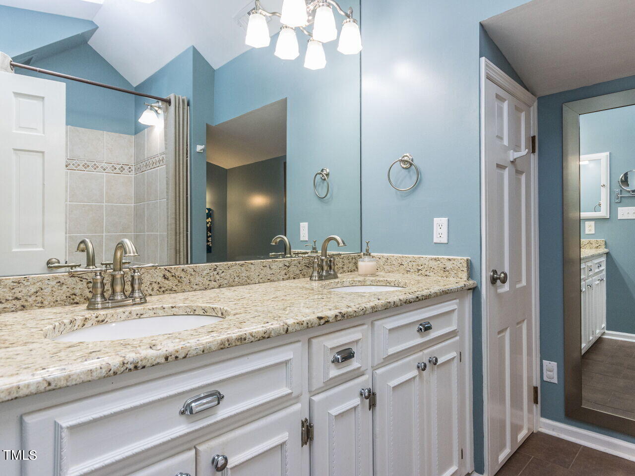 608 Ortega Road Raleigh, NC 27609 - Photo 21 of 34 Granite counters in primary bath.