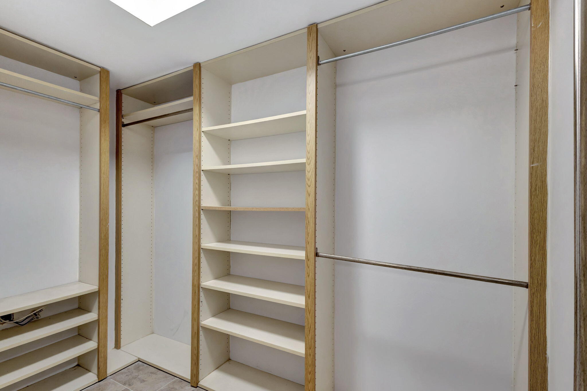 2741 Village Boulevard, Unit 104 West Palm Beach, FL 33409 - Photo 17 of 37 a view of walk in closet with empty racks