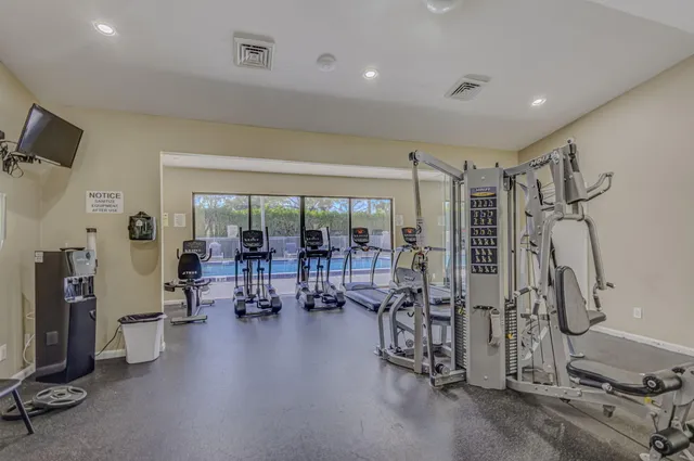 a gym room with lots of gym equipment