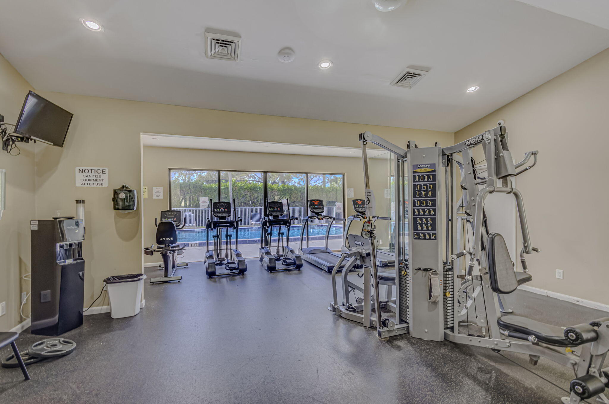 2741 Village Boulevard, Unit 104 West Palm Beach, FL 33409 - Photo 30 of 37 a gym room with lots of gym equipment