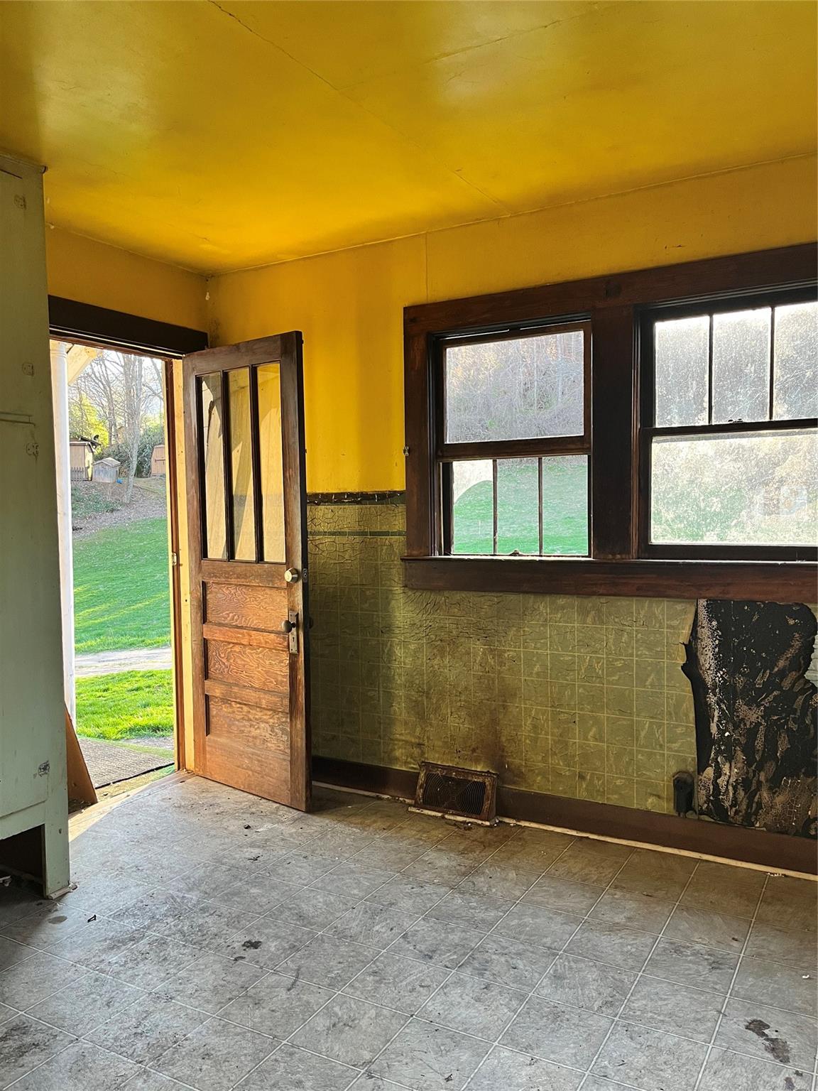 172 Rice Cove Road Canton, NC 28716 - Photo 14 of 36 an empty room with windows