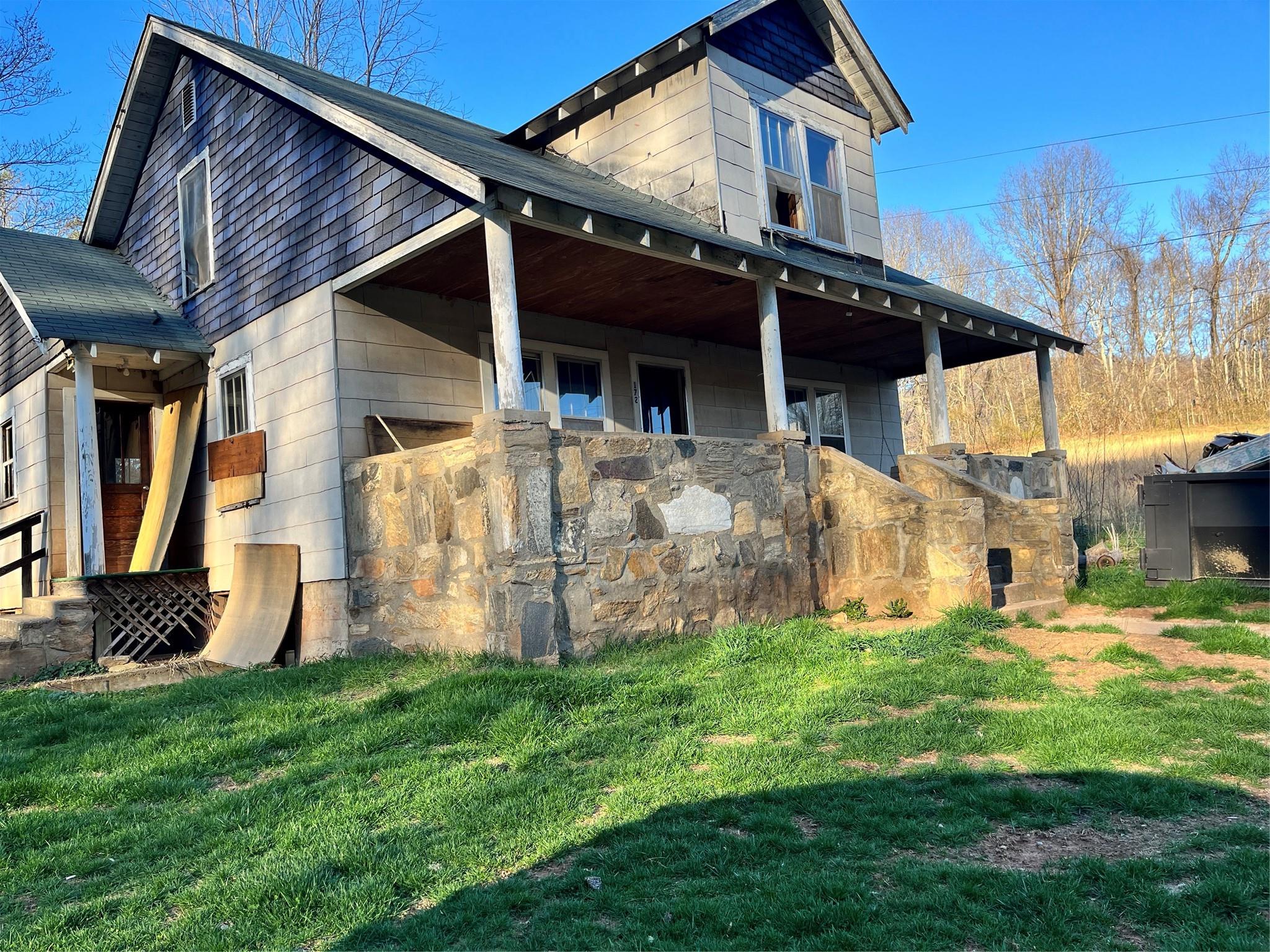 172 Rice Cove Road Canton, NC 28716 - Photo 2 of 36 a view of a house with a yard