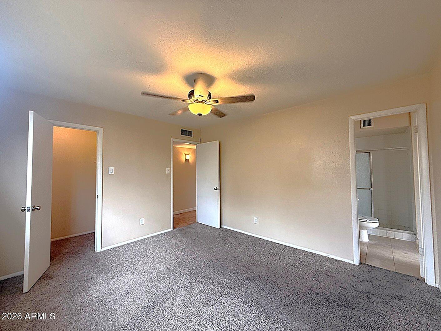 4625 South Rita Lane Tempe, AZ 85282 - Photo 9 of 16 a view of an empty room and a bathroom