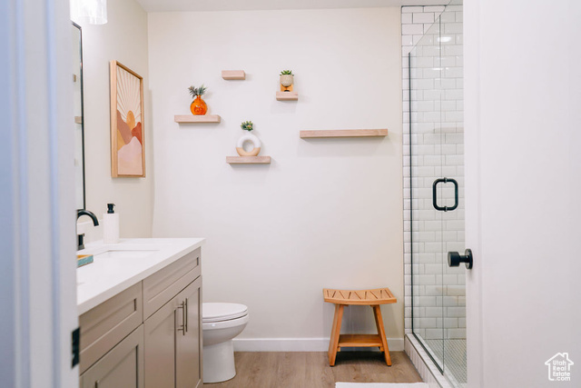 961 West Akoya Pearl Road, Unit 201 St. George, UT 84790 - Photo 21 of 67 Full bathroom featuring vanity, a shower stall, and wood finished floors