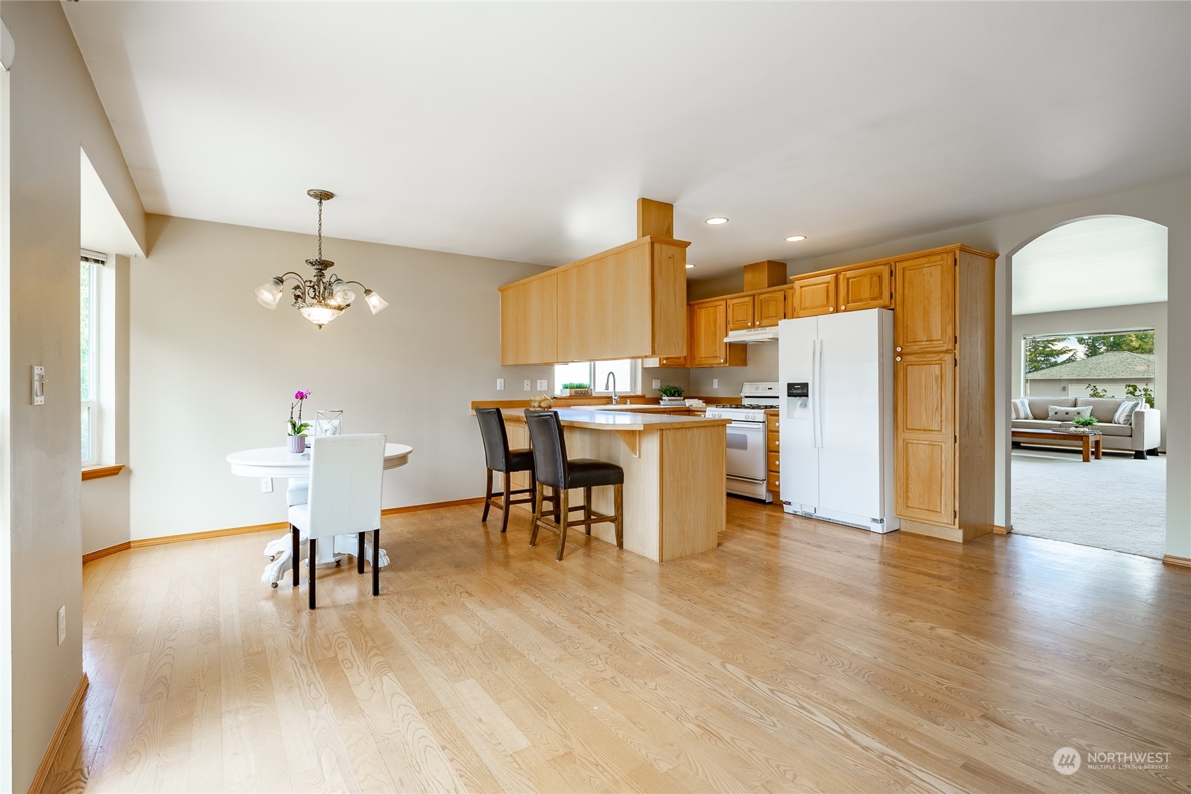 8087 Kispiox Road Blaine, WA 98230 - Photo 13 of 37 a view of a dining room with furniture and a chandelier