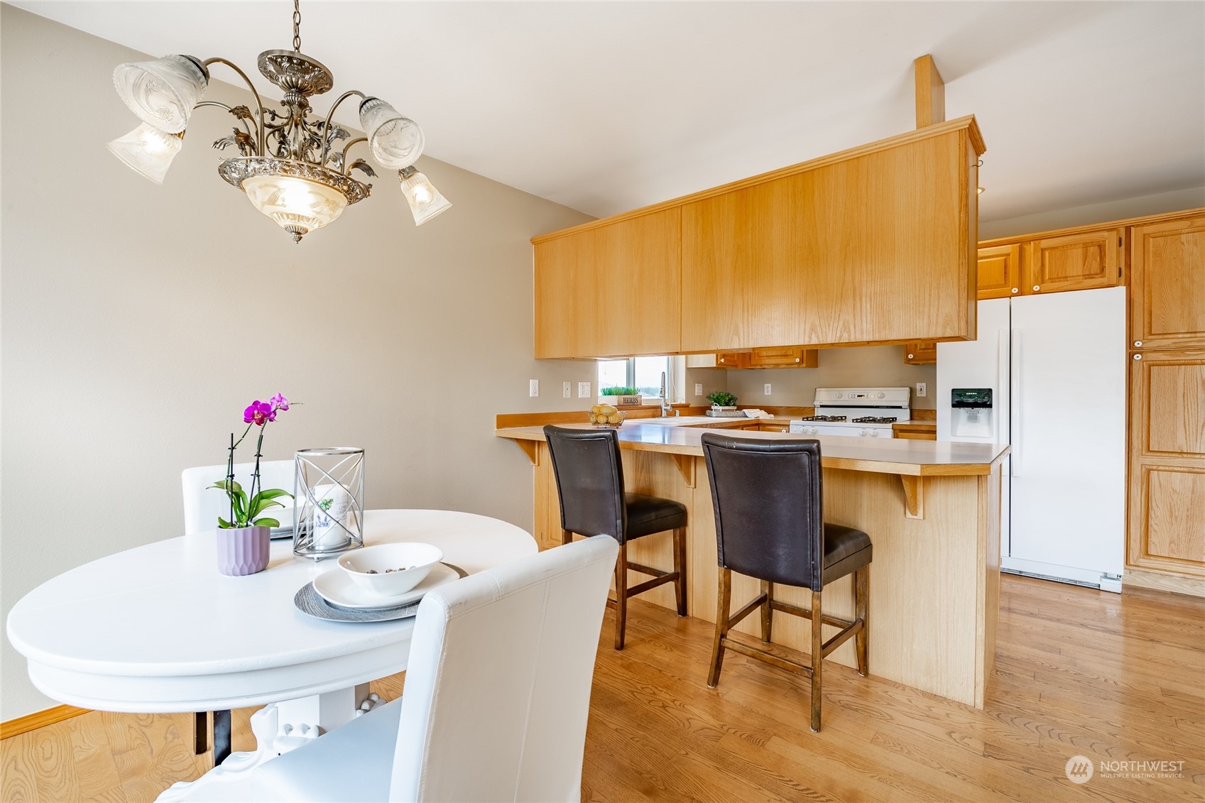 8087 Kispiox Road Blaine, WA 98230 - Photo 14 of 37 a view of a dining room with furniture and wooden floor