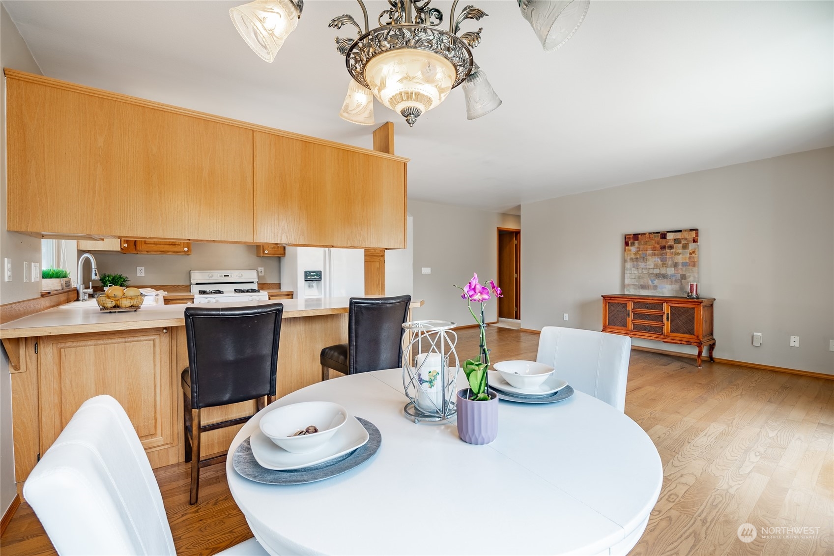 8087 Kispiox Road Blaine, WA 98230 - Photo 15 of 37 a dining room with furniture a chandelier and kitchen view