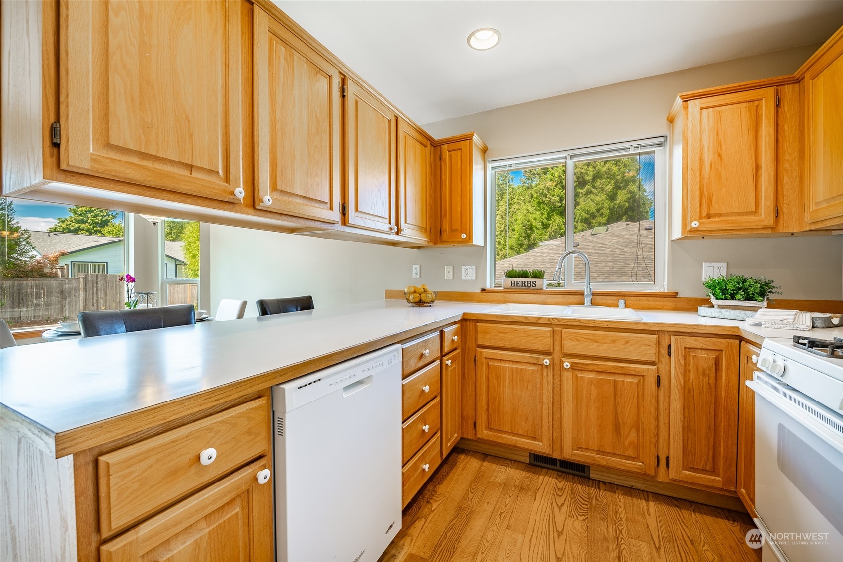 8087 Kispiox Road Blaine, WA 98230 - Photo 17 of 37 a kitchen with stainless steel appliances granite countertop a sink a stove and a refrigerator