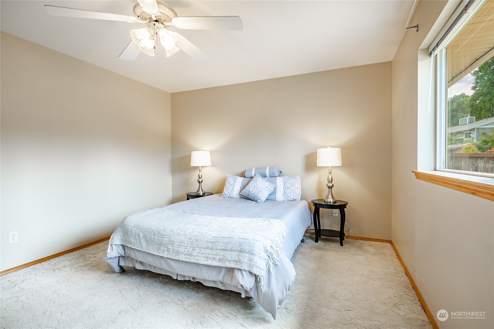 8087 Kispiox Road Blaine, WA 98230 - Photo 20 of 37 a bedroom with a bed and a chandelier