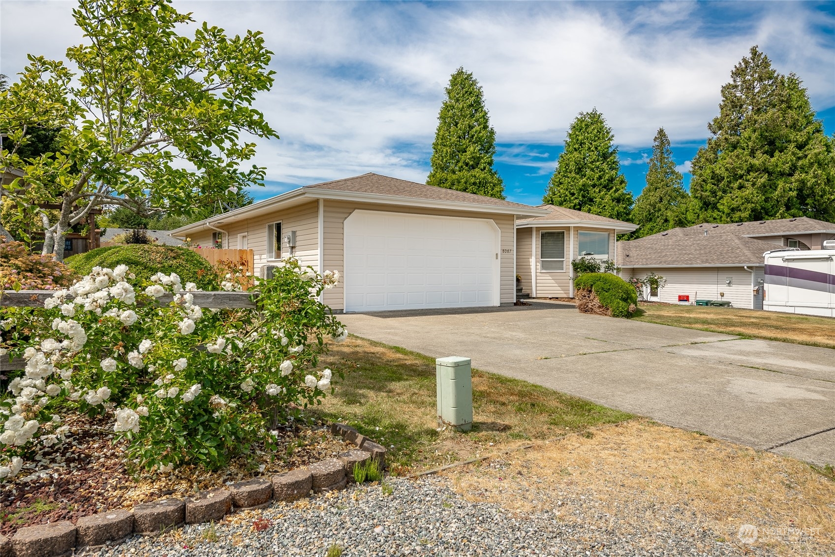 8087 Kispiox Road Blaine, WA 98230 - Photo 2 of 37 a front view of a house with garden